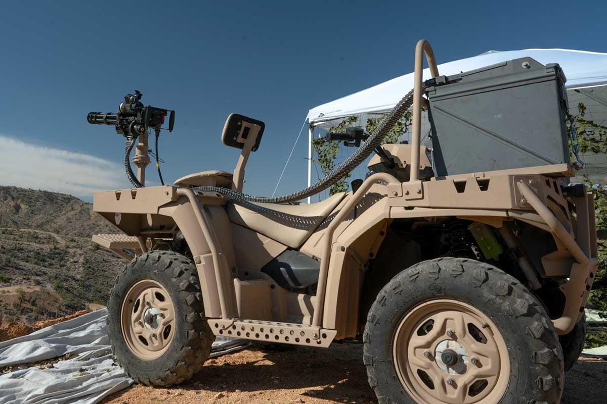 minigun mounted on the back of a Polaris four-wheeler