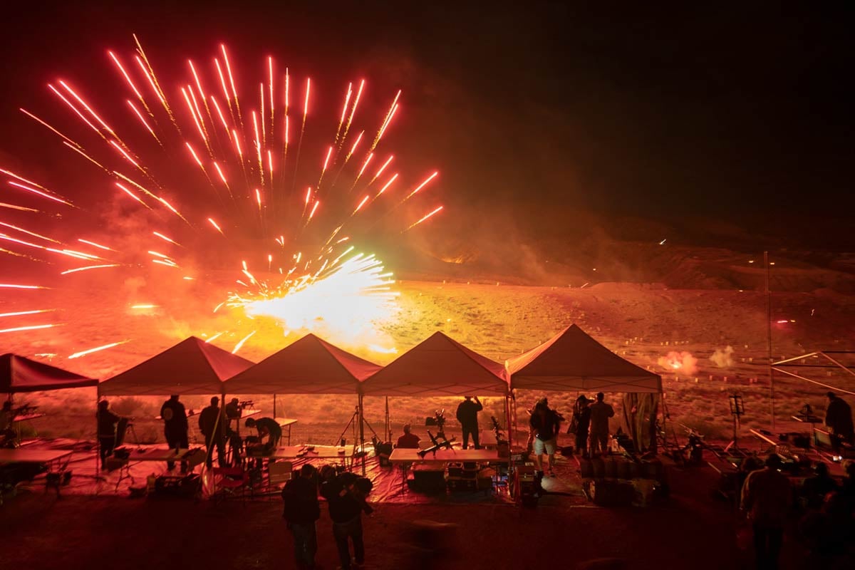 Bullets ignite fireworks during the night shoot