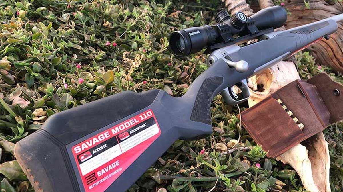 Savage Model 110 with ammo on ground