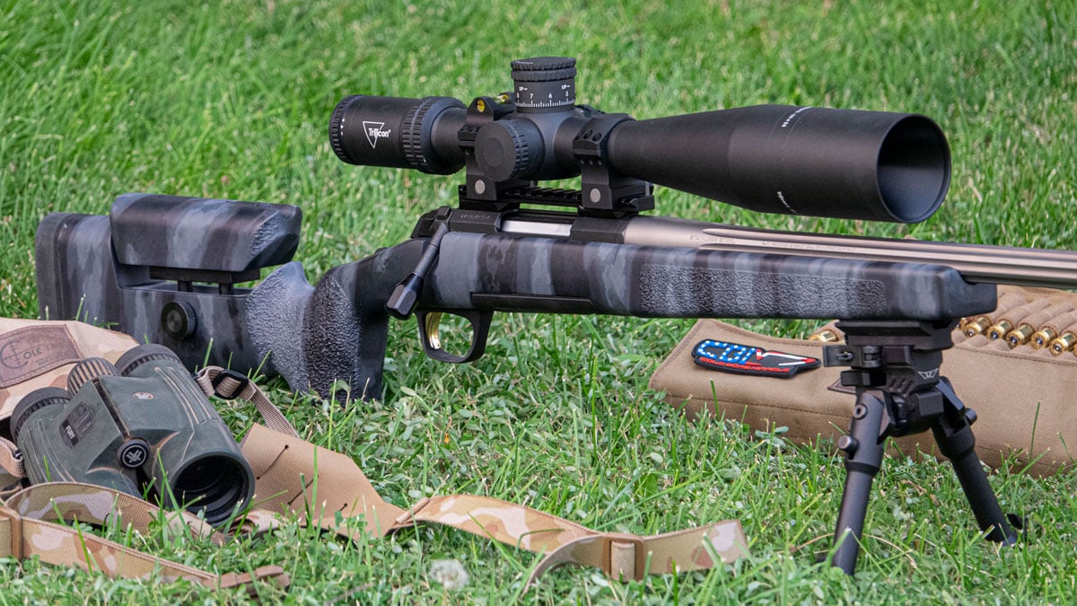 Browning X-Bolt rifle with on grass at range