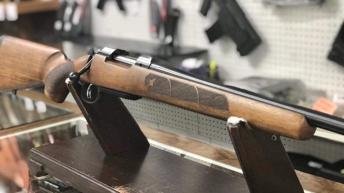 CZ 557 rifle on gun counter