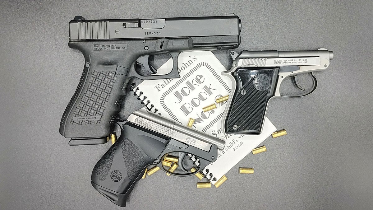 A Beretta 21A next to other pistols