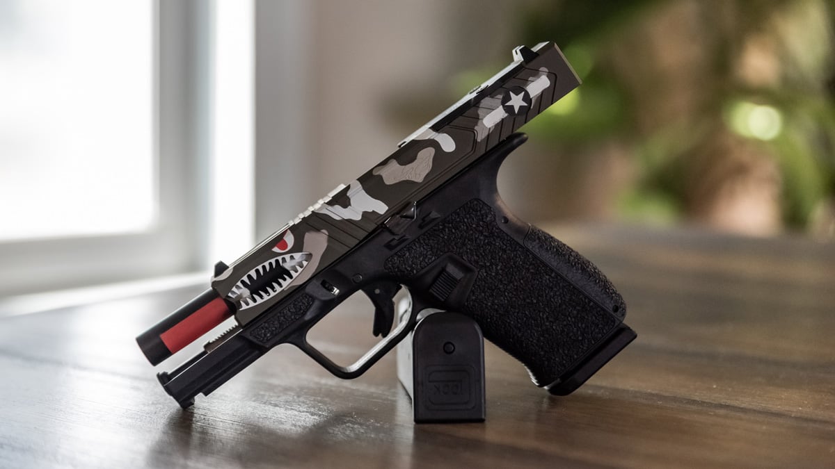 Cline Tactical C-19 Warbird pistol on a table