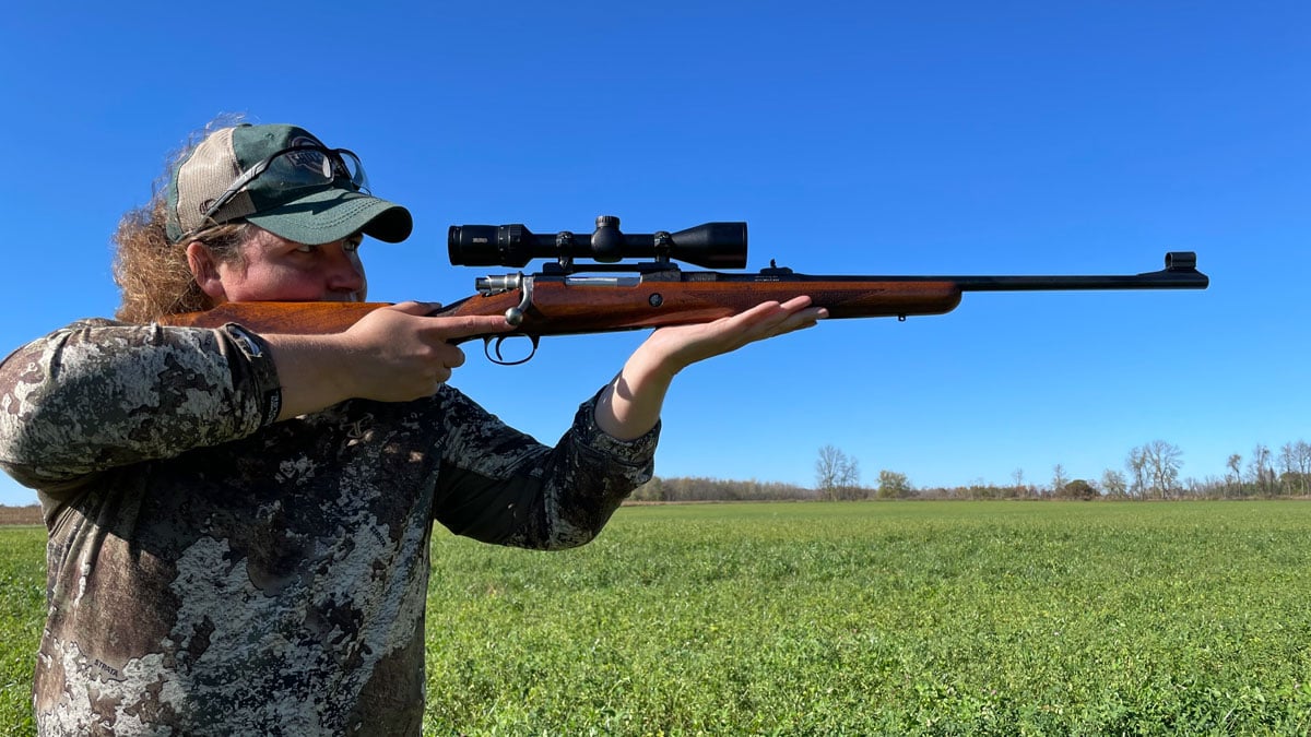 A woman shoots the Browning High Power Safari bolt action rifle