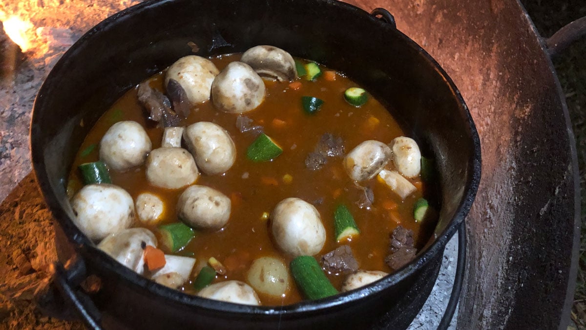 Kudu shanks cook in a potjiekos