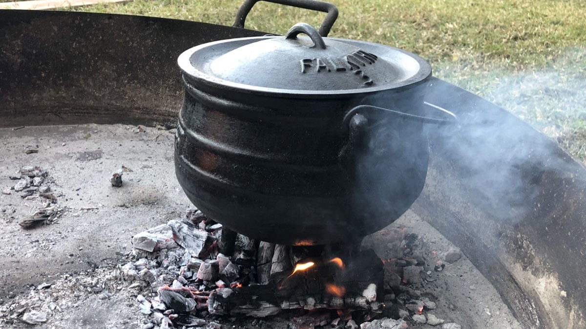 Kudu shanks cook in a potjiekos