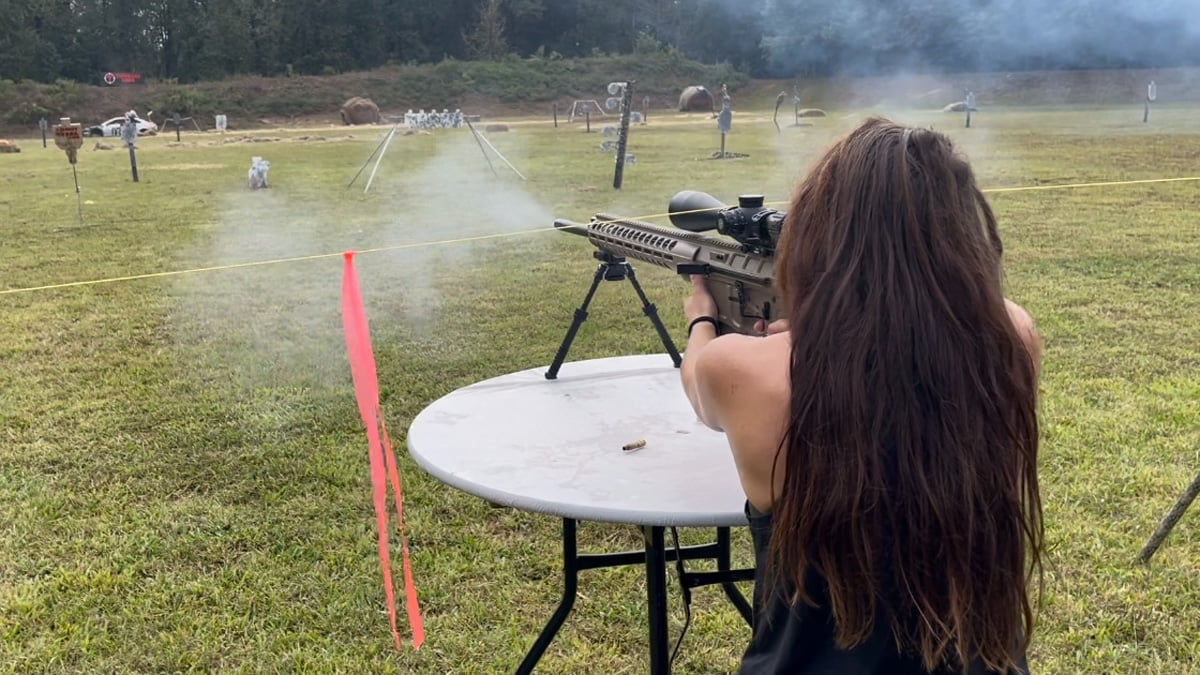 Taylor Abney fires a DRD Tactical rifle
