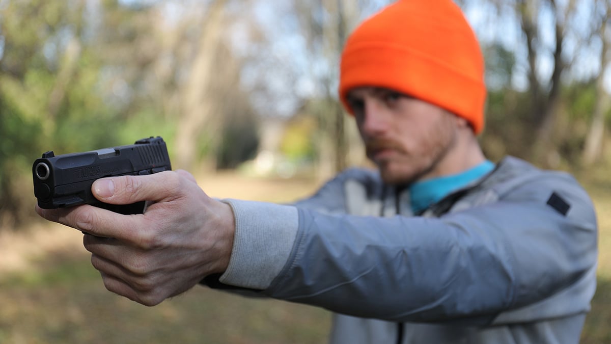 A shooter fires a G2C pistol