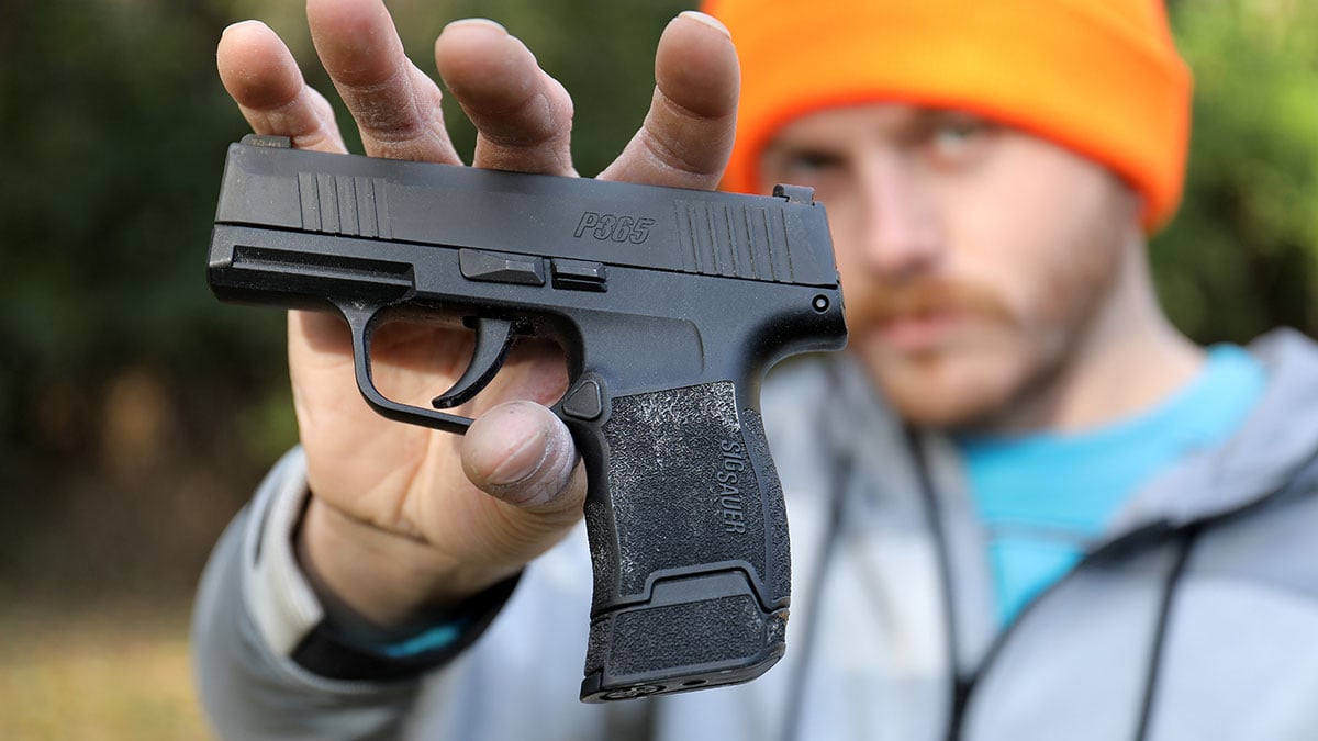 A man holds the Sig P365