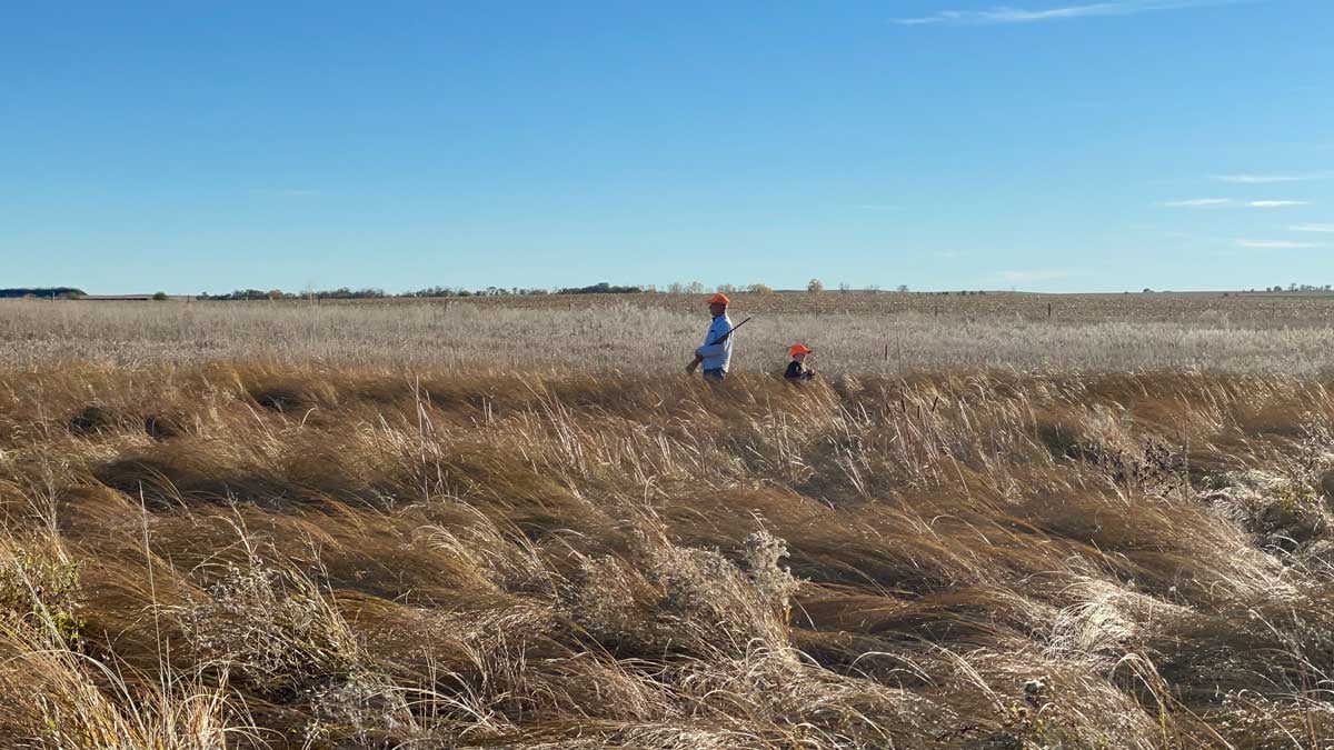 Hunters in the field with an Ithaca Model 37