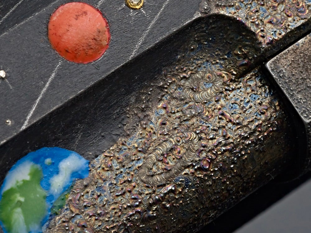 Cabot Guns Moonshot 1911 one-of-a-kind .45 made out of a lunar rock displayed on a black background