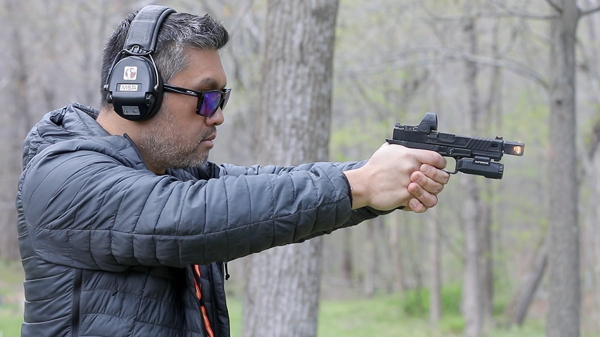 Pistol with compensator shooting