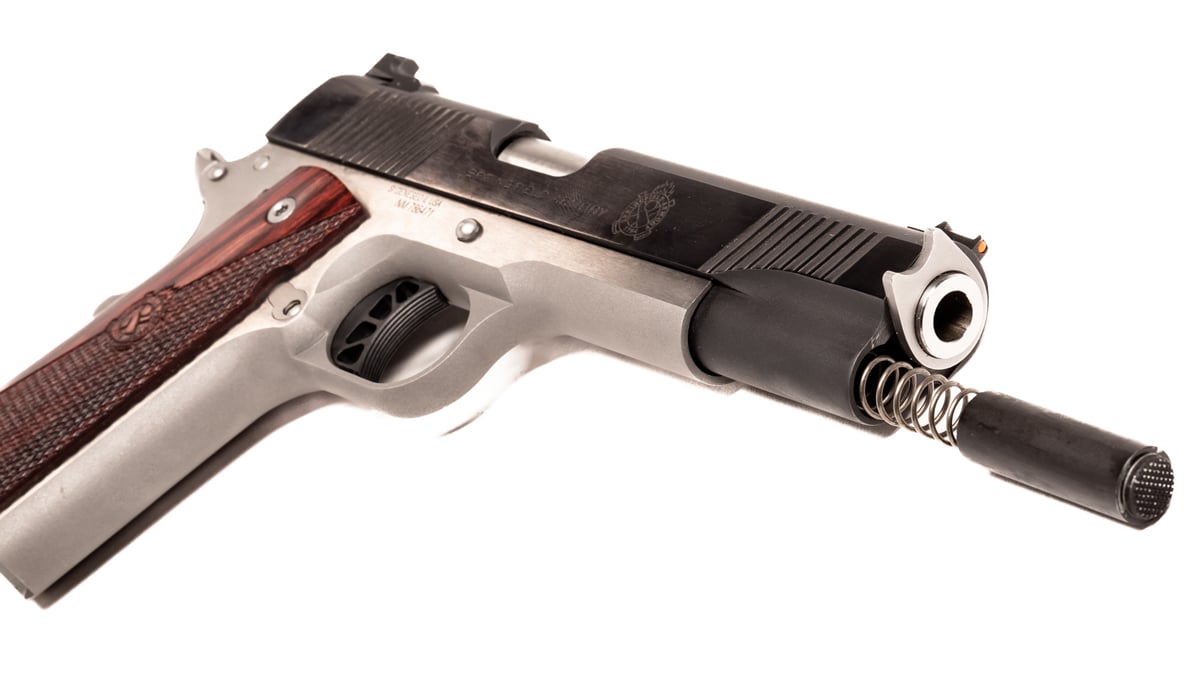 1911 pistol with recoil spring sliding out