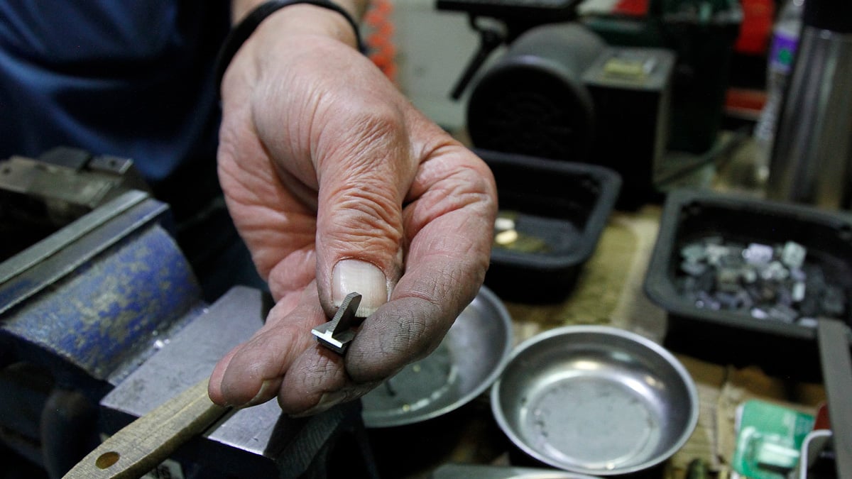 Skinner Sights front sight in worker's hand