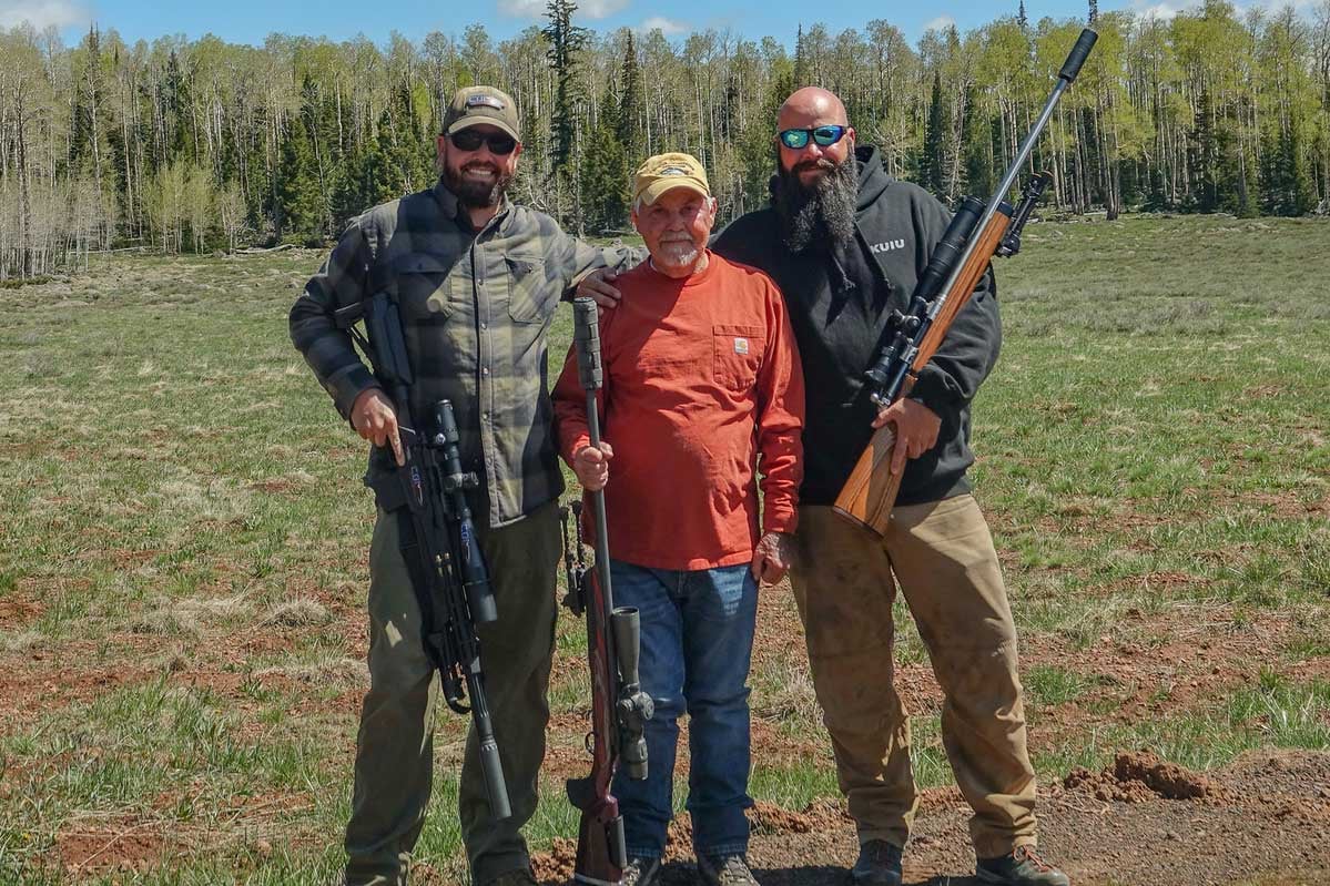 dad, my brother and I with rifles