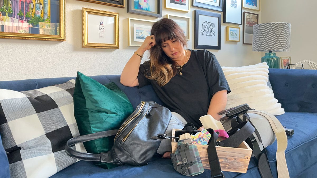Woman with concealed carry gear