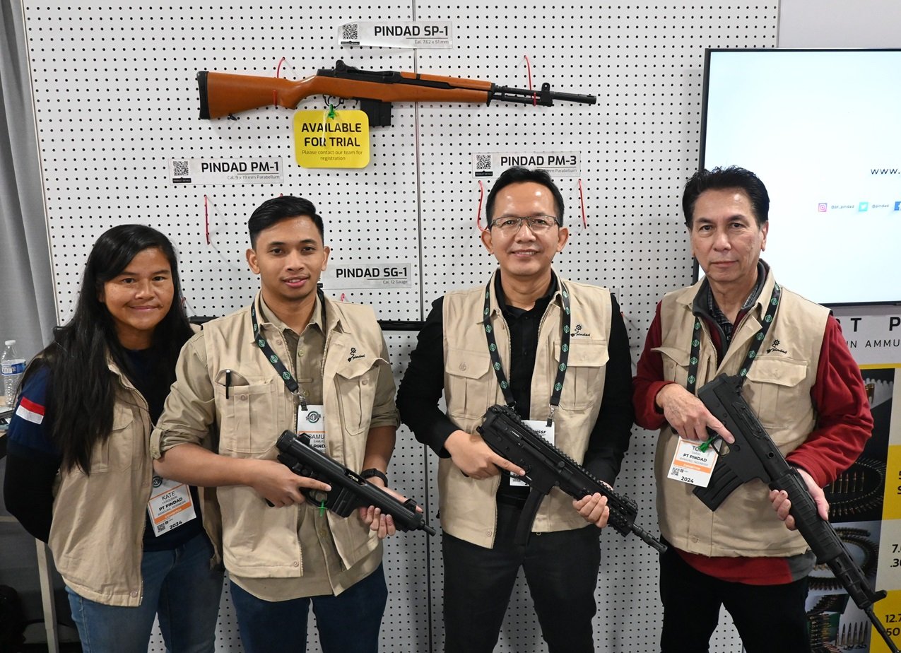 Kate Ferguson, Director of Terratek USA, Samuel with Pindad with a PM-1 9mm, Yayat Ruyat (VP of Marketing, Sales, Business Development) with a PM-3 9mm, and Tom Saras with Pindad with an SS1-C. (Photo: Chris Eger/Guns.com)