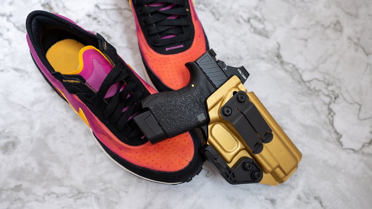 athletic shoes with Glock 48 in gold holster