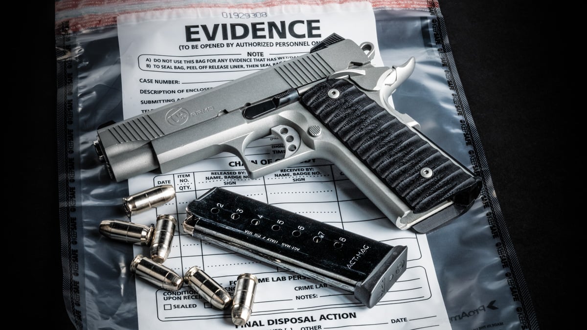 handgun with ammo and evidence bag