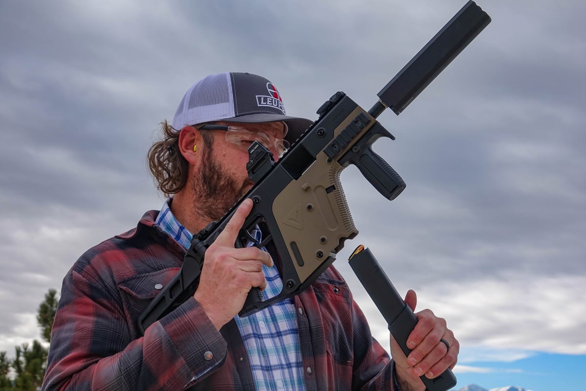 loading magazine into suppressed firearm