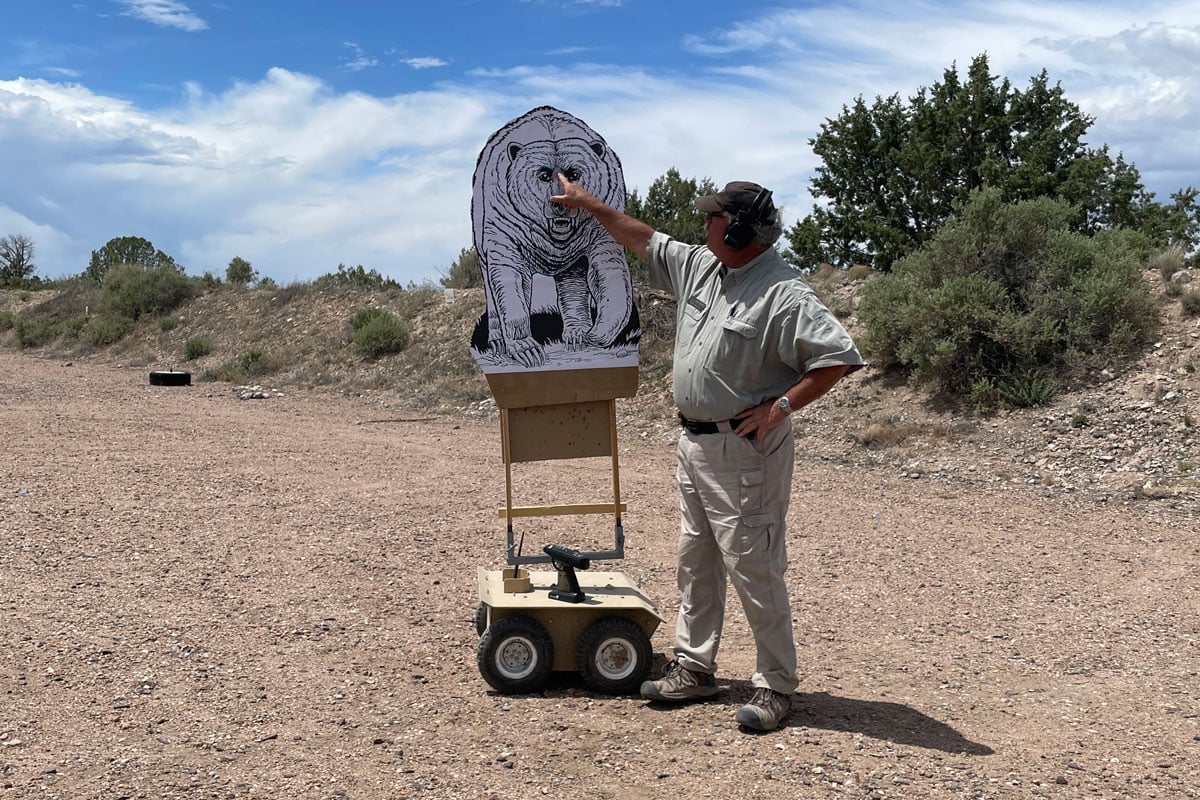 instructor pointing at bear target