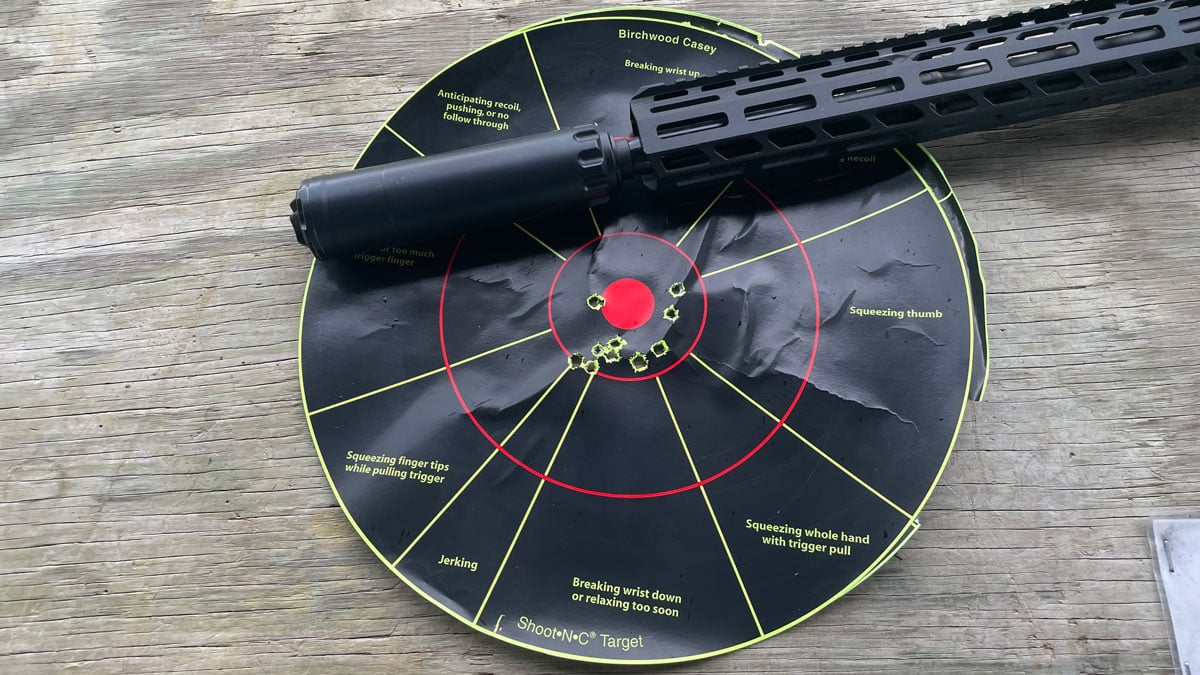 SIG Sauer M400 SDI X-series rifle with suppressor and target
