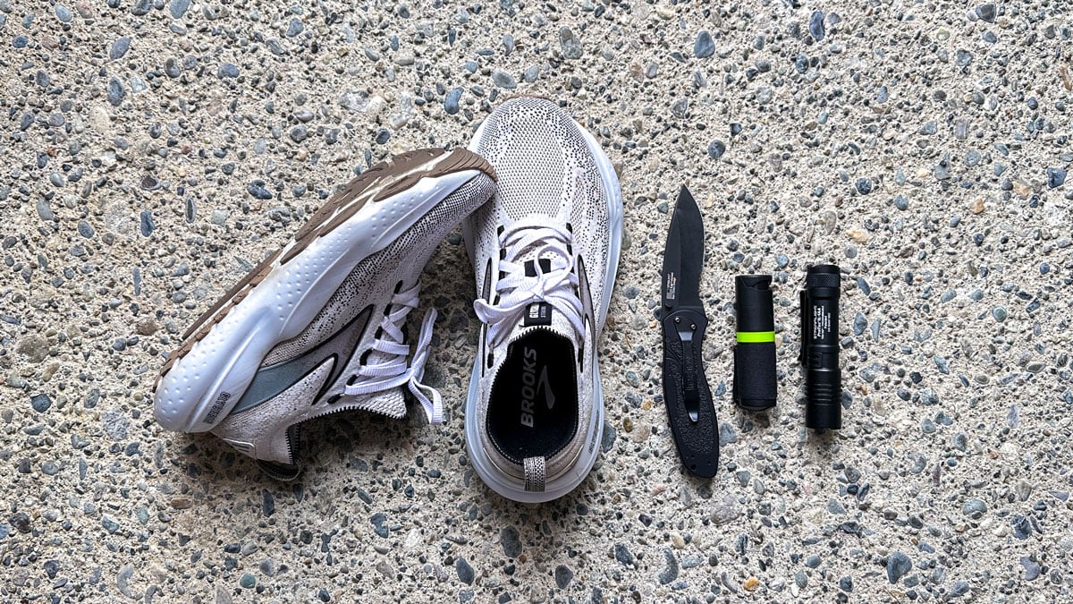 running shoes with knife and flashlight