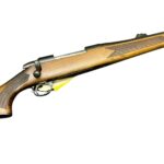 BSA bolt action rifle with wood stock and blued barrel