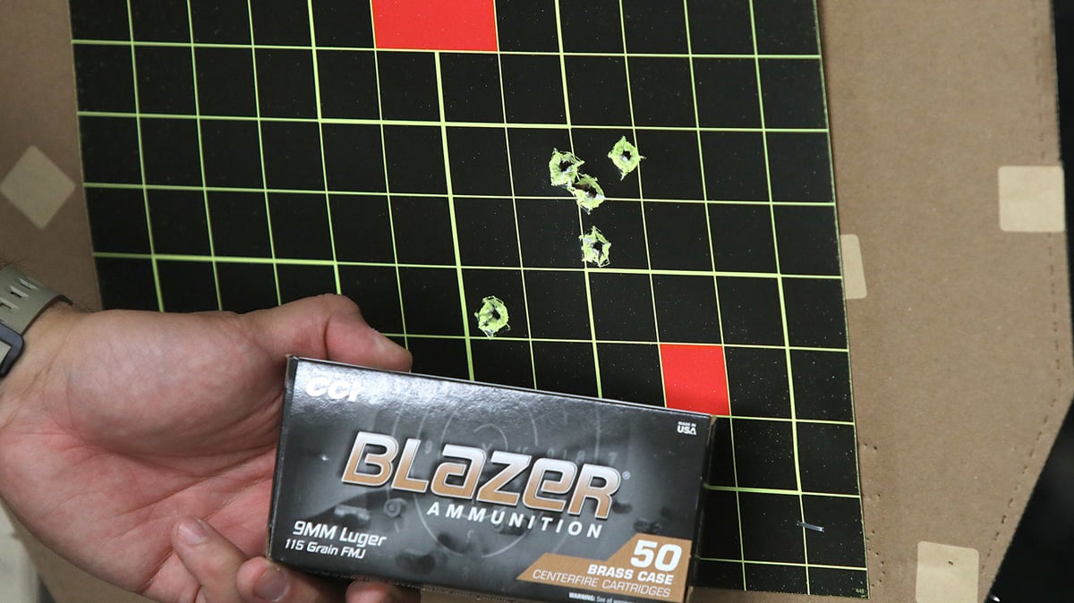 target with five-shot group and 9mm ammo