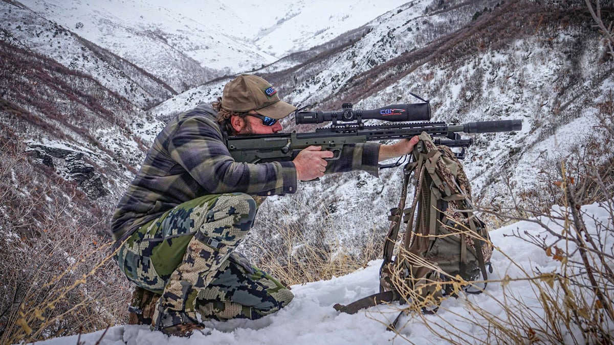 hunter in snowy mountains