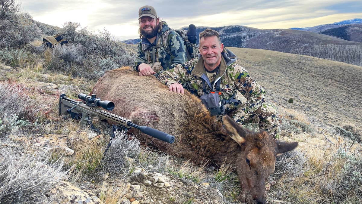 hunters with elk