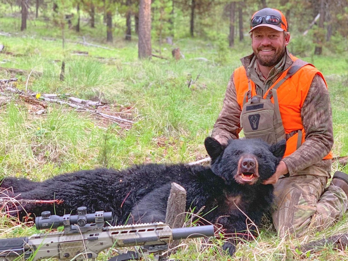 hunter with black bear