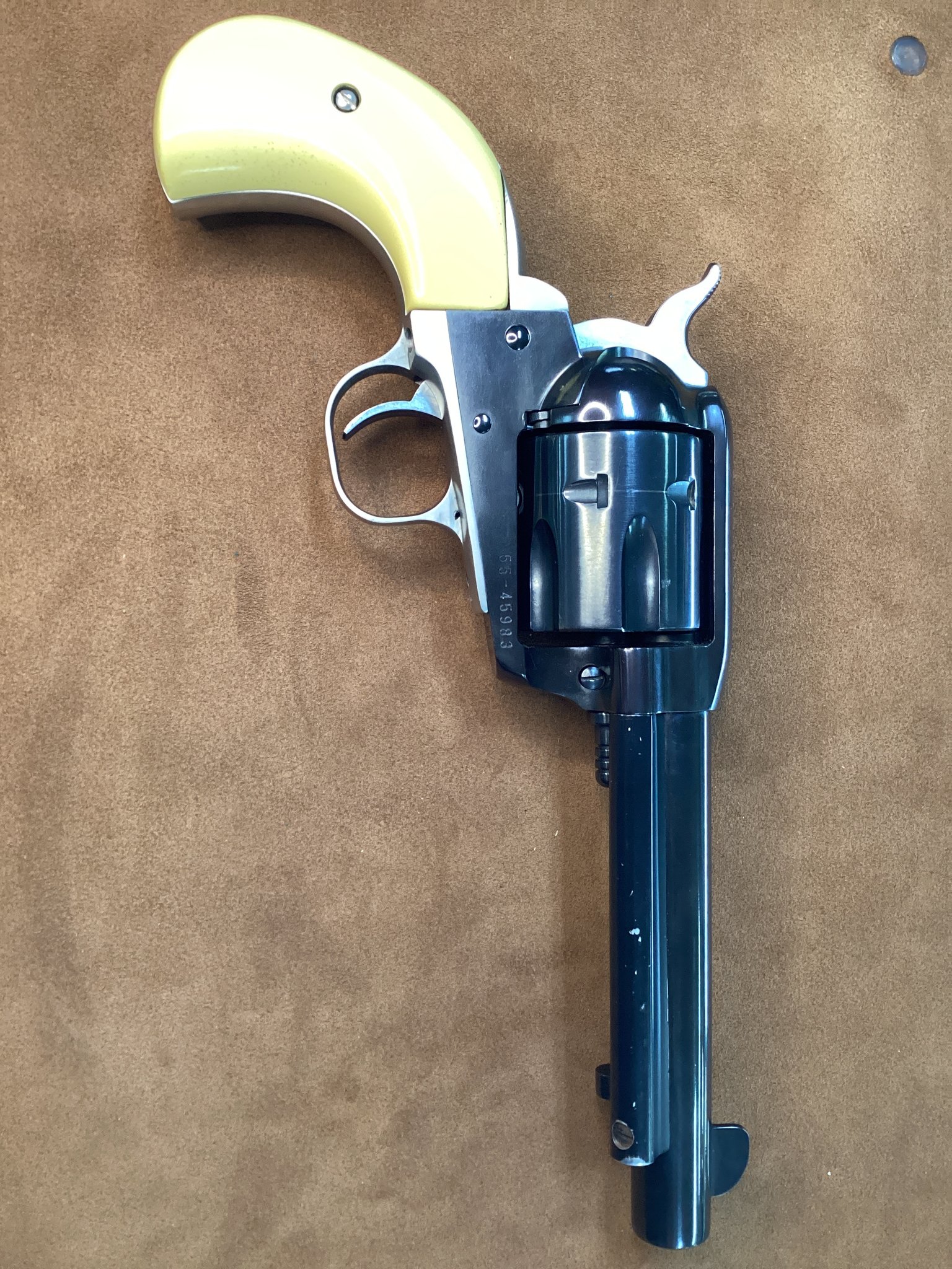 Ruger Vaquero Birds Head stainless revolver with synthetic white ivory grips