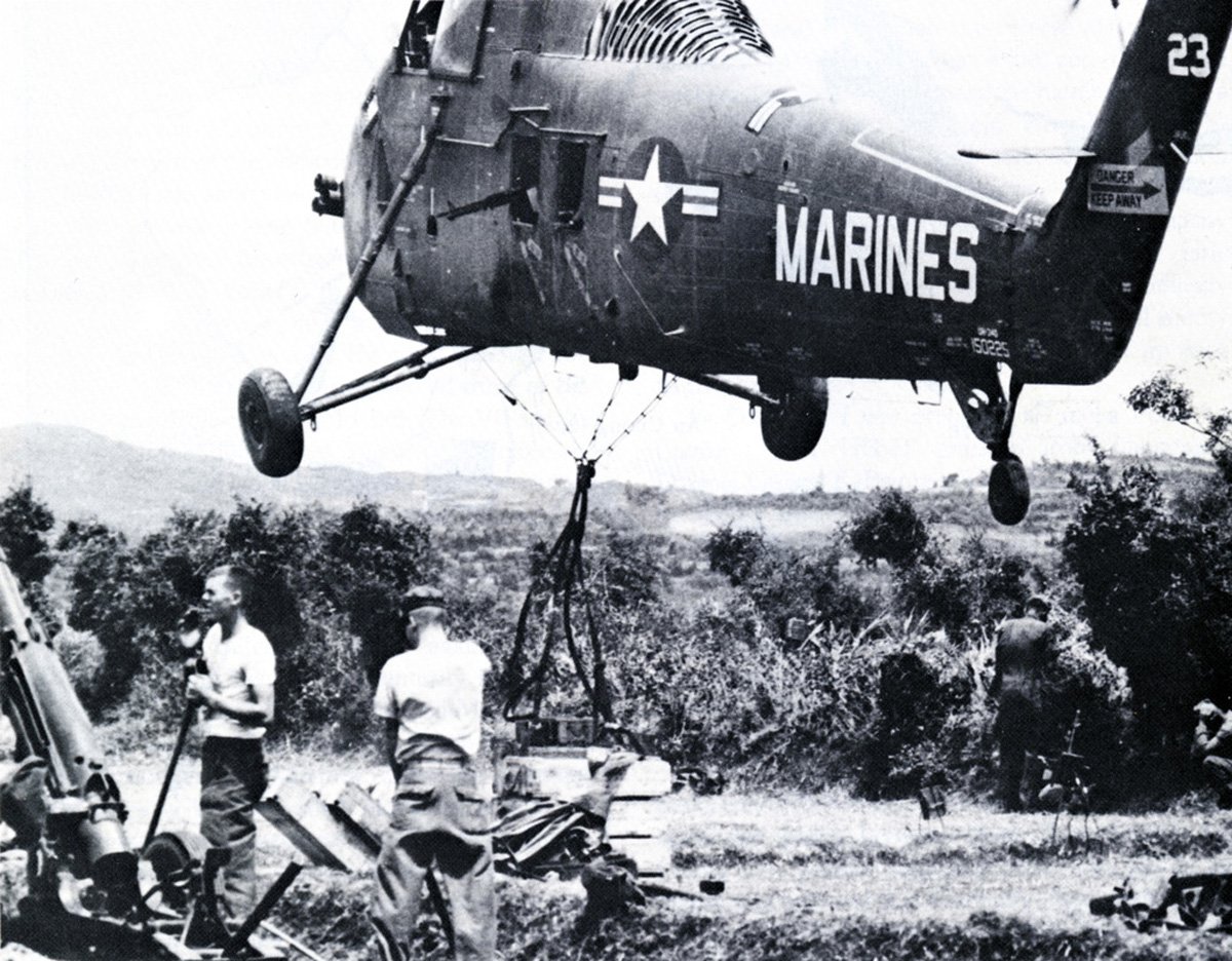 A Marine helicopter drops off artillery in Vietnam
