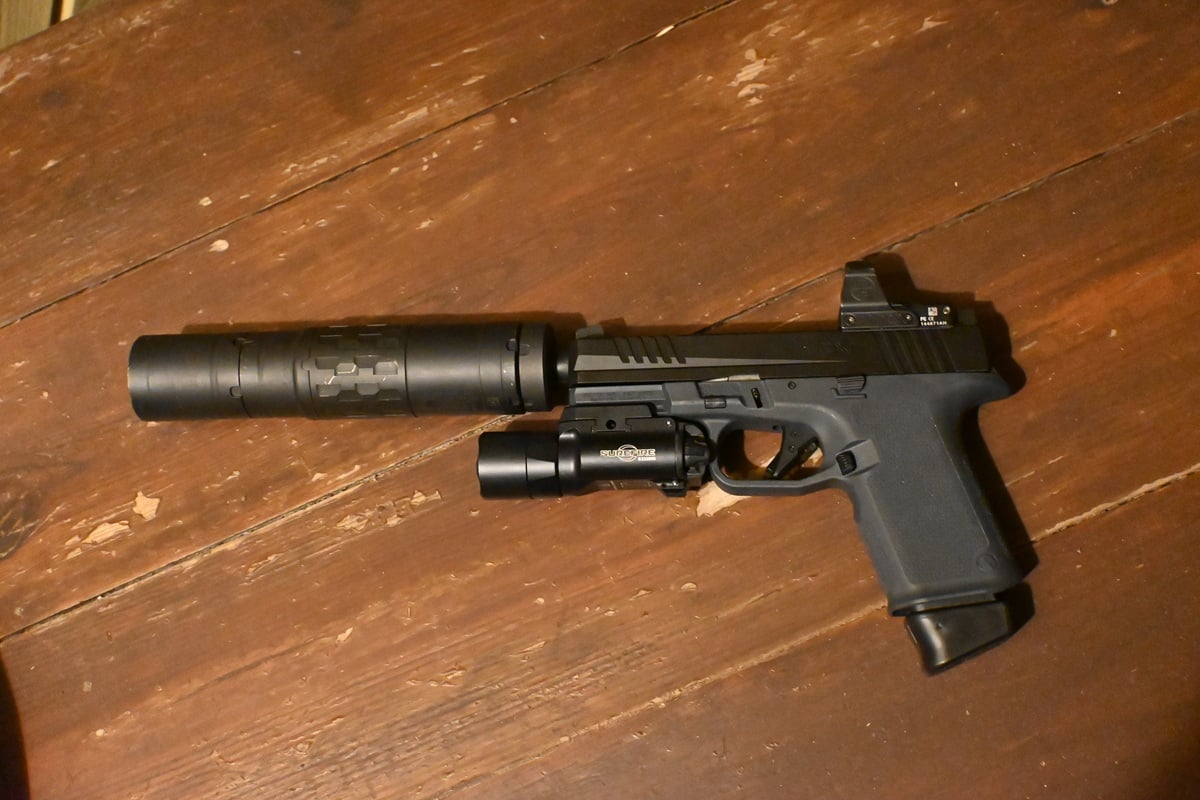 ruger rxm shown with a silencer attached