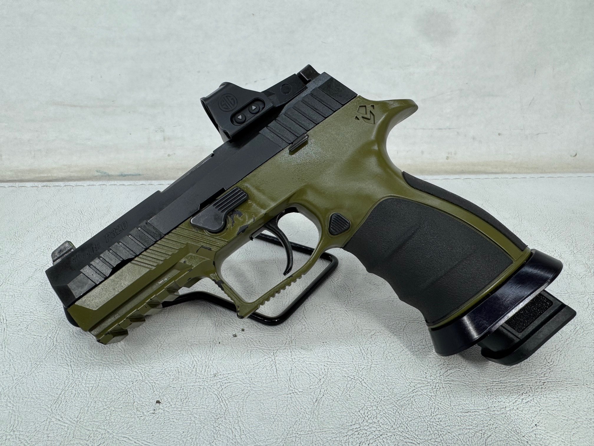 SIG SAUER P320 Custom Works 9mm pistol angled view