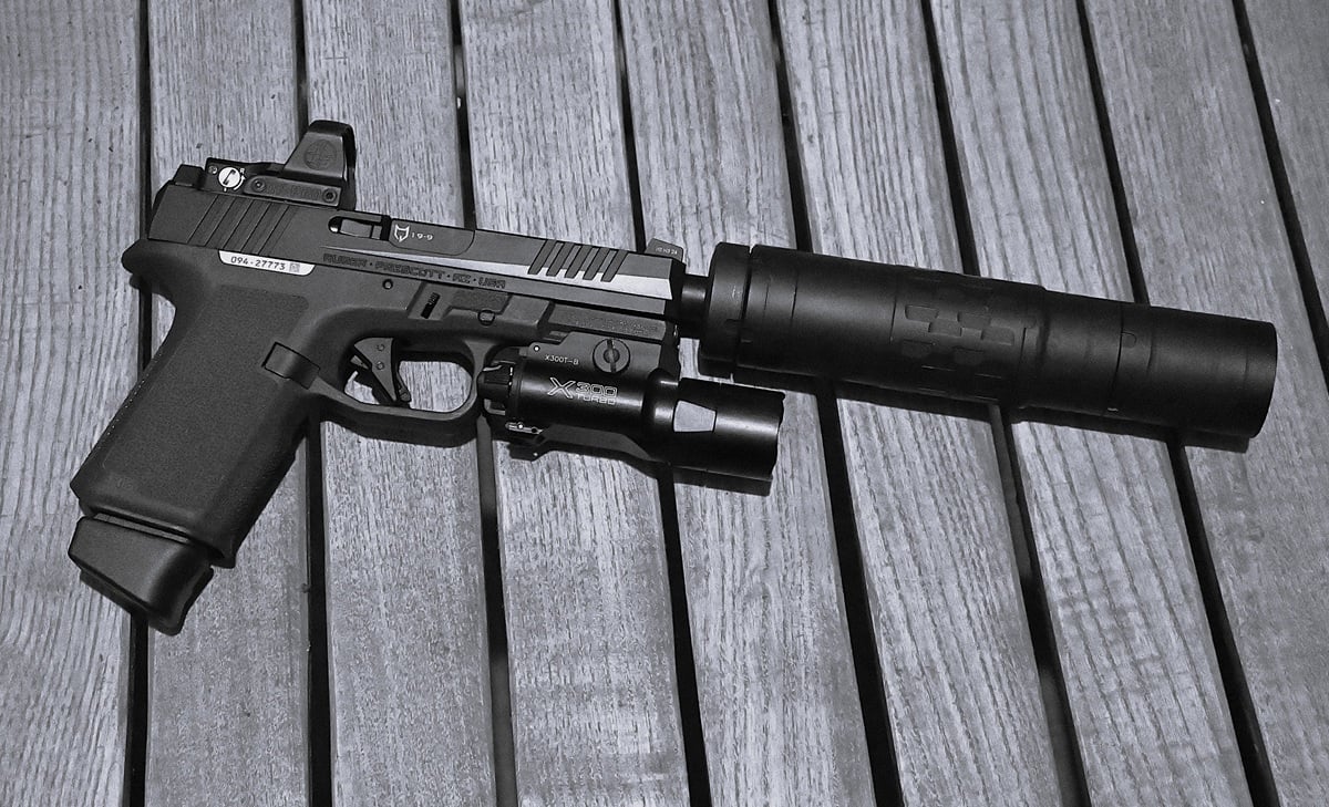 ruger rxm with a suppressor attached