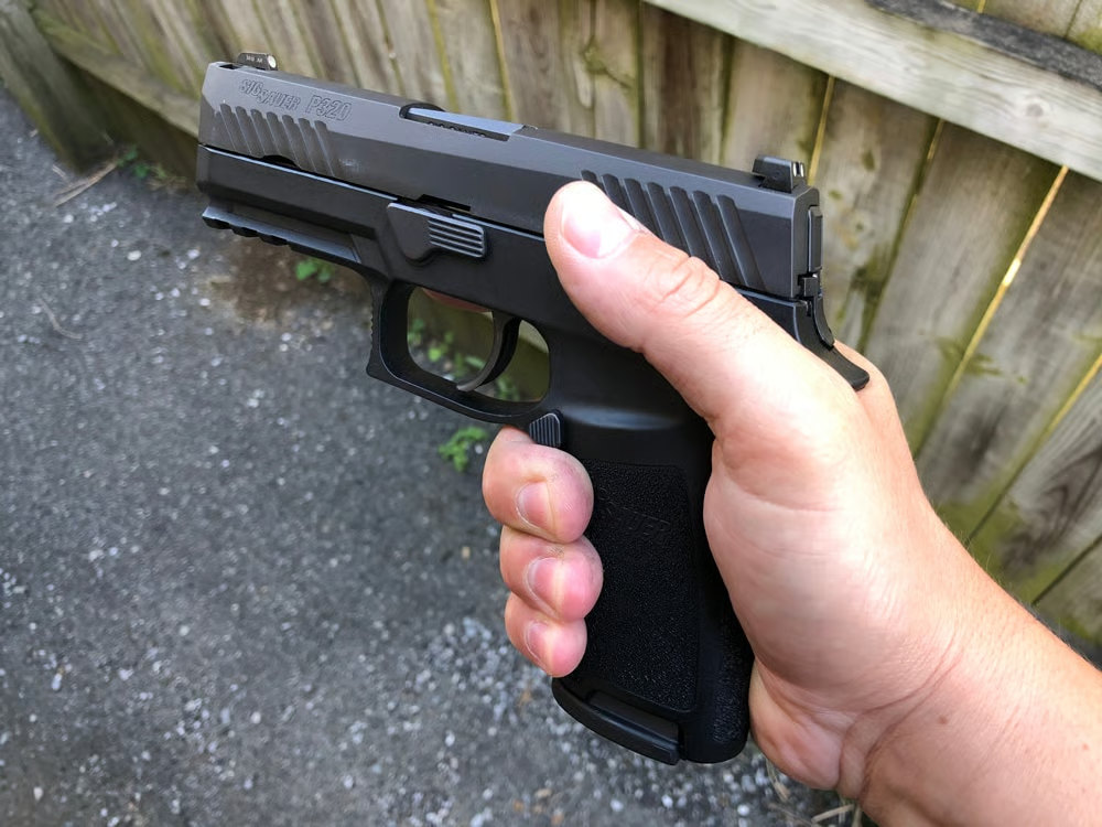 sig p320 compact shown in reviewer's hand