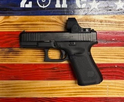 GLOCK Glock 19 Gen 5, 4.02" Barrel, Black, 9mm Semi Auto Pistol. Trijicon SRO 5.0 MOA.