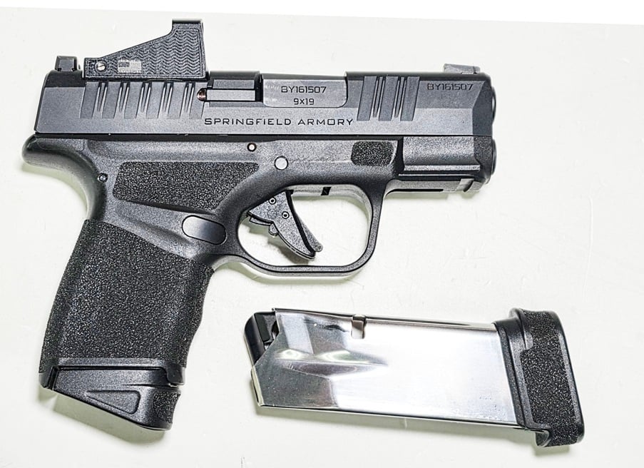 SPRINGFIELD ARMORY HELLCAT CHAMBERED IN 9MM HAS A "SPIKE" RED DOT
