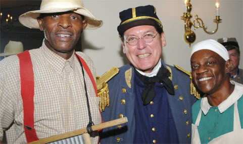 SC Lt. Gov. Glenn McConnell posing with two Gullah storytellers at reenactment event.