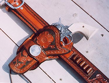 old school handgun in leather holster