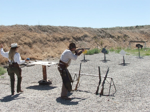 cowboys shooting outside at the range
