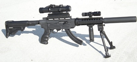 ruger 10/22 tactical rifle on white pavement