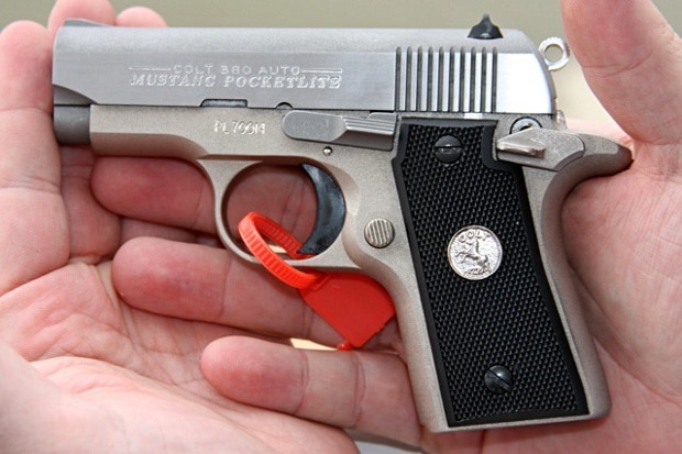 colt mustang pocketlite in palm of hand