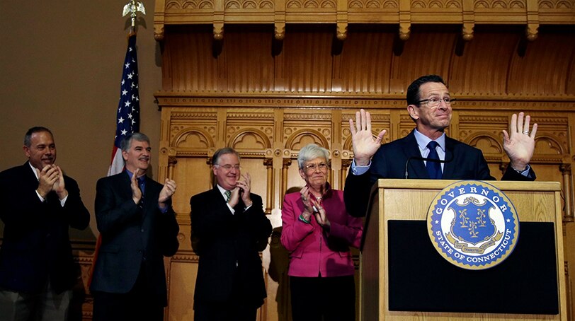 Gov. Dannel P. Malloy of Connecticut, with Lt. Gov. Nancy Wyman, thanked supporters in Hartford after securing a win for reelection Nov. 5, 2014. (Photo: New York Times)