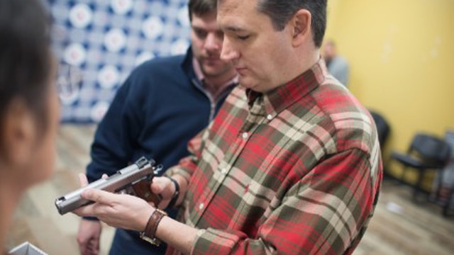 Sen. Ted Cruz looking at a 1911 pistol