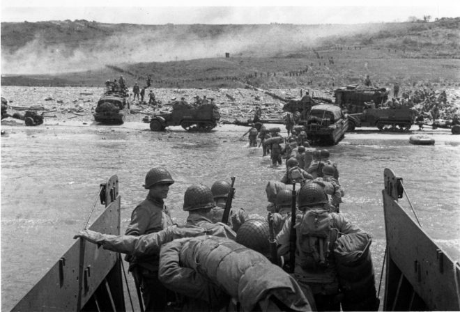 Troops wade ashore from a LCVP landing craft