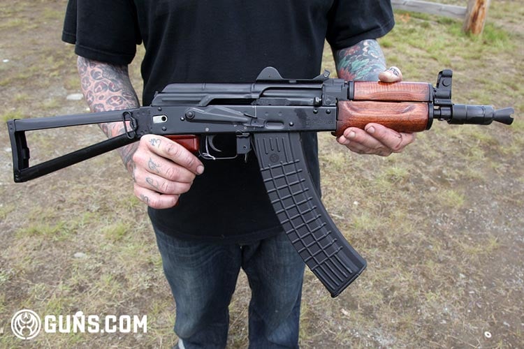 AK-47 with a chopped down barrel and extended magazine